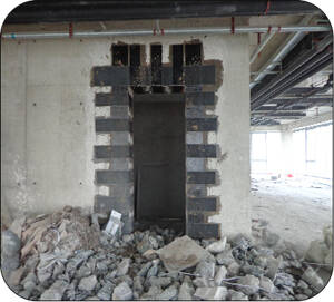 FRP Strengthening of Shear Walls with Openings